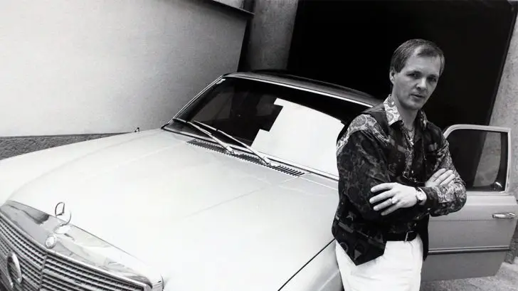 Jack Unterweger posing on a sports car